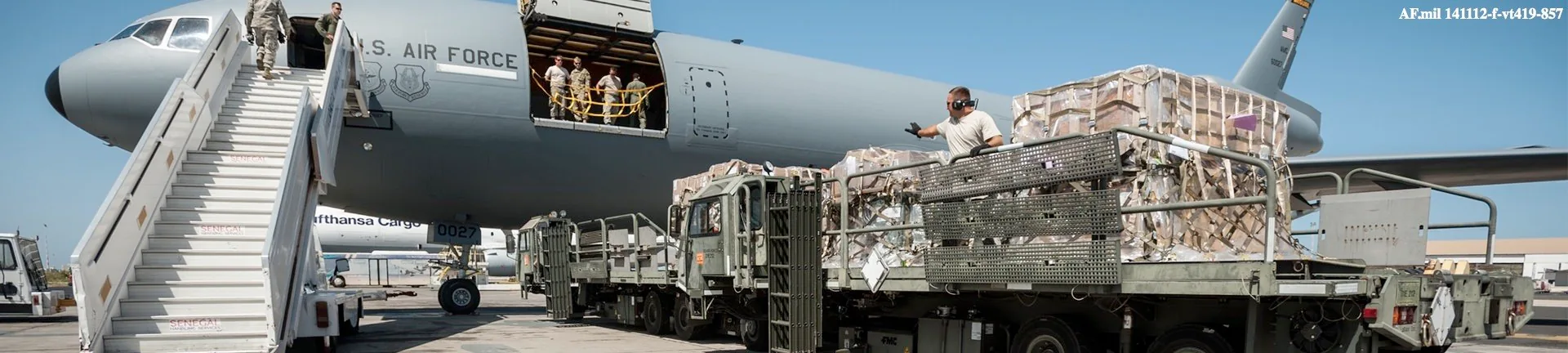 KC-10 aircraft with cargo pallets and loading equipment on the flight line